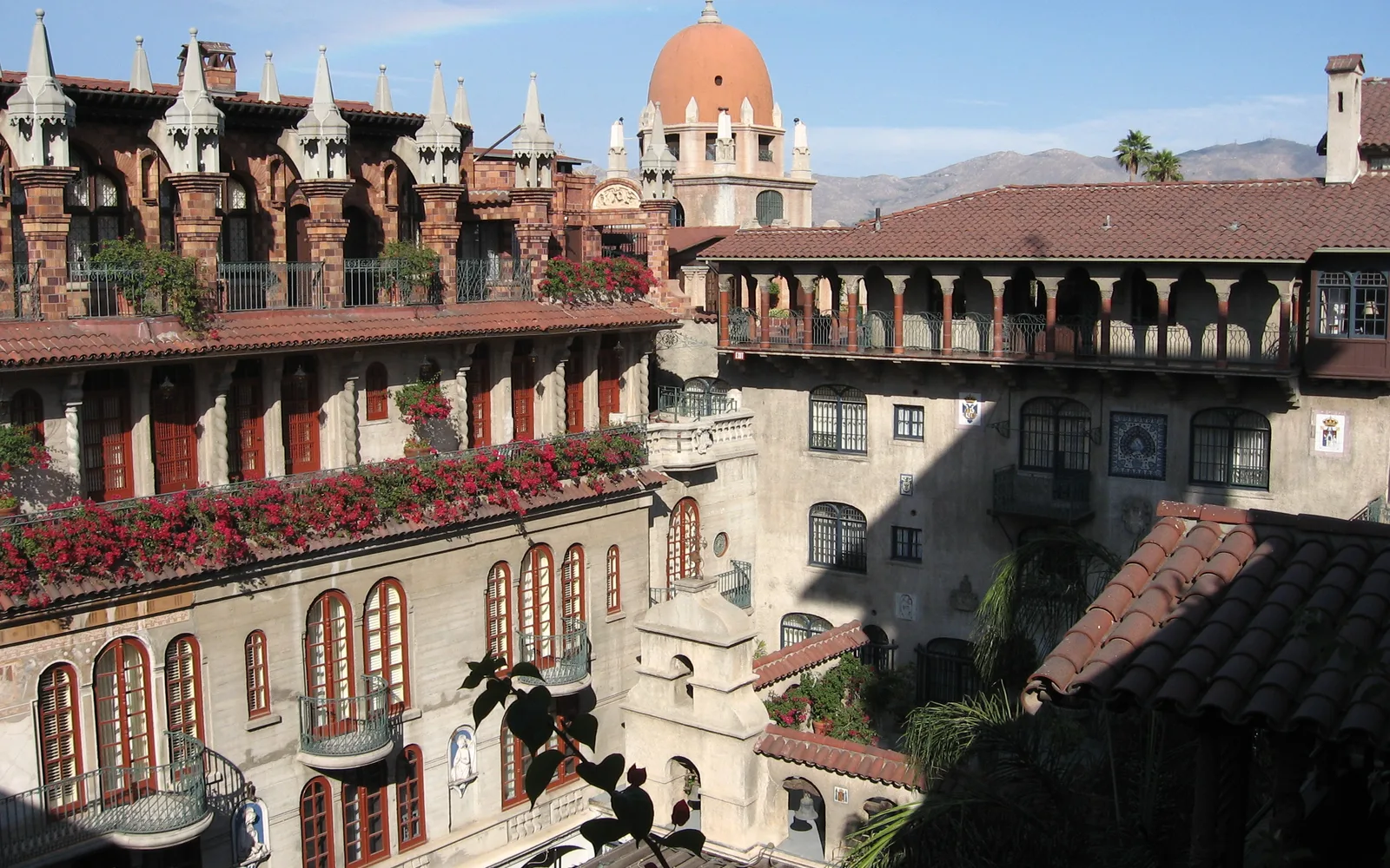 The Spanish Wing courtyard of Mission Inn, featuring arches, columns, and mission-revival architecture
